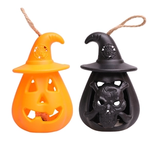 Detail of Halloween pumpkin and skull lanterns with witch hats and rustic rope handles