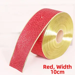 Detail of 10cm wide red glitter ribbon with gold edges for Christmas tree decoration