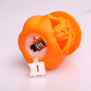Bottom view of Halloween pumpkin lantern light showing battery compartment and power switch