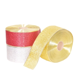Three rolls of glitter Christmas ribbons in red, gold, and silver for tree decoration