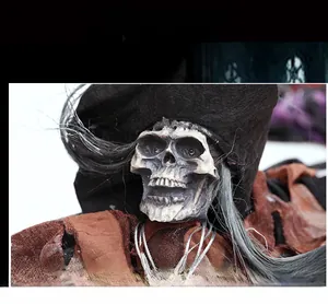 Close-up of Halloween hanging ghost skull with gray hair and tattered fabric texture