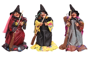 Detailed trio of Halloween witch dolls with pointed hats and straw brooms on white background