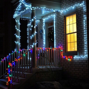 Festive LED string lights in warm white and multicolor for house and porch decoration