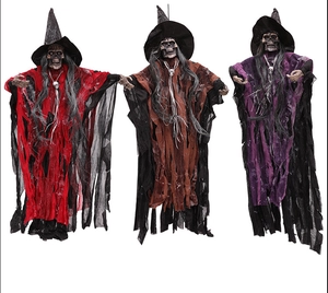 Three hanging Halloween skeleton witches in red, brown, and purple with pointed hats