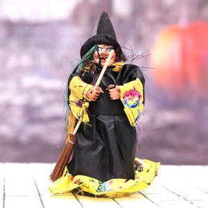 Halloween witch doll with broomstick in black and yellow robe for party home decor