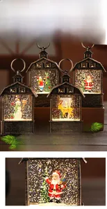 Detail of Christmas lantern with metal texture showing Santa Claus and glitter snow