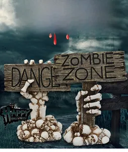 Halloween skeletal hand holding Danger and Zombie Zone signs on skull base decoration