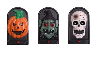 Three Halloween doorbells featuring pumpkin, witch, and skull designs with red buttons