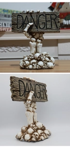 Detail of Halloween skeleton hand danger sign desktop ornament with vintage skull base texture