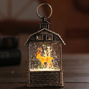 Detail of vintage Christmas lantern with a yellow deer and sparkling glitter in warm light