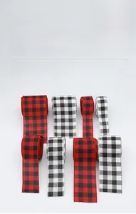 Detail of red-black and white-black plaid Christmas ribbons for gift wrapping