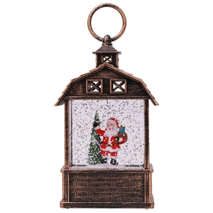 Close-up of bronze vintage Christmas lantern with Santa Claus and festive glitter