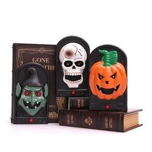 Halloween doorbell set with witch, skull, and pumpkin figures in tombstone frames