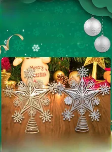 Detailed view of hollow snowflake star tree toppers in glittering gold and silver metal