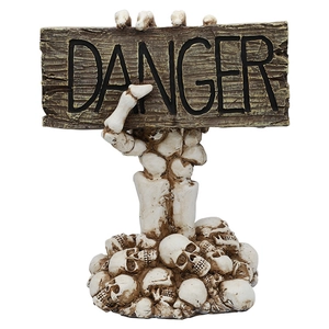 Halloween decorative skeleton hand holding a Danger sign with a skull base table ornament