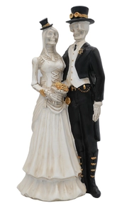 Detail of gothic resin skeleton bride and groom figurines for Halloween wedding decor