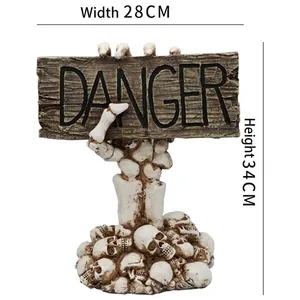 Halloween danger sign with skeletal hand and skulls base, dimensions 28cm width and 34cm height