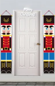 Detail of Nutcracker soldier porch banners hanging on white doors for Christmas decor