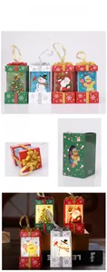 Set of four Christmas lantern ornaments including Santa and Snowman with warm LED light