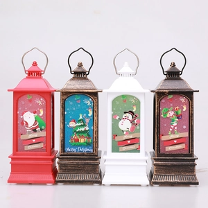 Set de cuatro farolillos LED de Navidad con motivos de Papá Noel, muñeco de nieve y texto