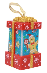 Close-up of a festive red and blue Christmas gift box ornament with golden sequins