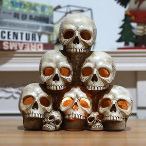 Halloween skull stack decor with LED glowing eyes and antique resin bone texture