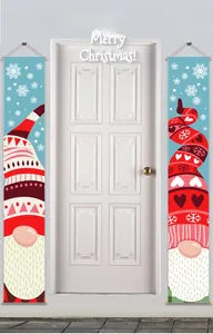 Detail of Christmas gnomes door banners with white snowflake patterns on blue background