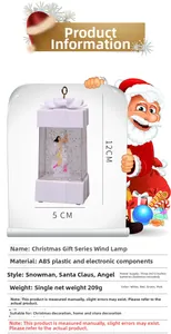 Detailed view of white Christmas lantern featuring interior angel figurine and dimensions