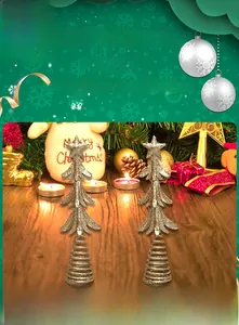 Macro detail of two gold glitter layered Christmas tree toppers with spring bases