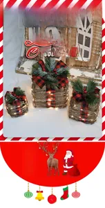 Macro view of three lighted rattan Christmas gift boxes with bows and red berries