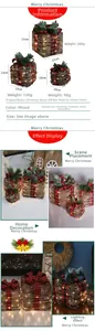 Detailed view of LED Christmas gift boxes with red plaid fabric and pine cone decor