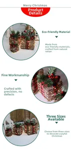 Close-up of lighted rattan Christmas gift boxes with pine needles and red berries