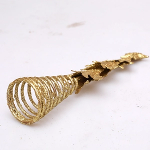 Golden iron Christmas tree topper star with sparkling glitter finish and spiral spring base