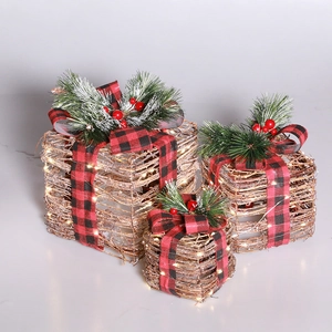 Three rattan Christmas gift boxes with LED lights and red plaid bows for holiday decor