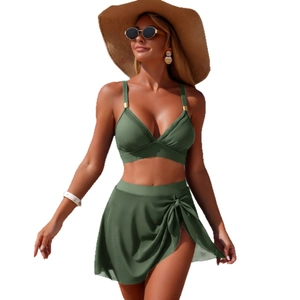 Olive green two-piece bikini set with high waist swim skirt and halter top detail