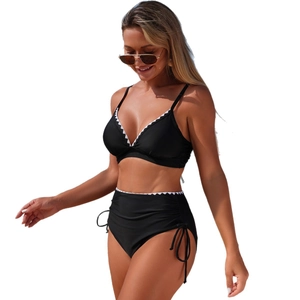 Black high-waisted shell-stitched bikini set with white scalloped trim and halter top