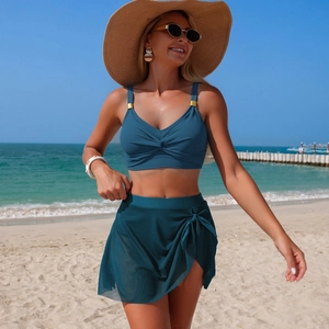 Navy blue two-piece swimsuit featuring a twist-knot bikini top and a mesh skirt for beachwear