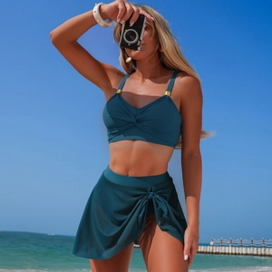Close-up of dark green bikini top with front knot and golden decorative square buckle