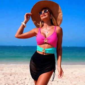 Detailed shot of bikini with mesh sarong and decorative golden flower accessories