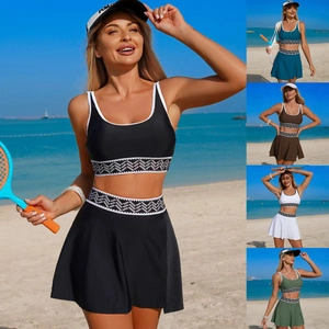 Detail of two-piece sports tennis set featuring geometric wave pattern waistband and hem