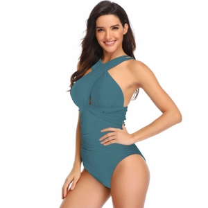 Detail of teal one-piece swimsuit with criss-cross neck and flattering ruched waist