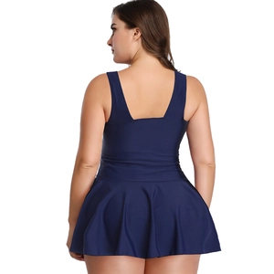 Detail of plus size navy blue swim dress featuring wide straps and a deep U-shaped back