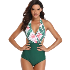 Detailed view of the halter neck and tropical leaf print on this one-piece swimsuit