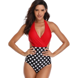 Deep V-neck one-piece swimsuit featuring red halter top and black polka dot high waist