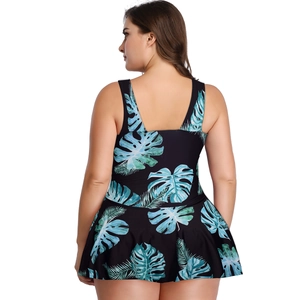 Detail view of plus size modest swimdress back with tropical leaf print and thick straps