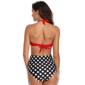 Back view of red halter bikini top and high waisted black white polka dot bottoms