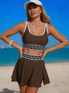 Brown two-piece sporty swimsuit set with white trim and tennis skirt for beach activities