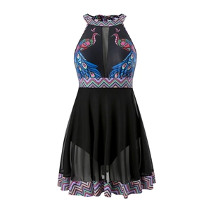 Close-up of halter one-piece swimsuit featuring mesh cut-outs and peacock print