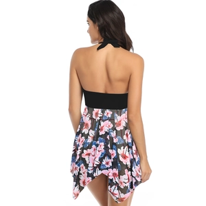 Back view of halter neck floral swim dress with black mesh panels and irregular hem