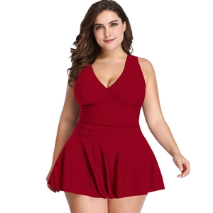 Detail of plus size wine red swimsuit featuring a V-neck design and pleated skirt hem